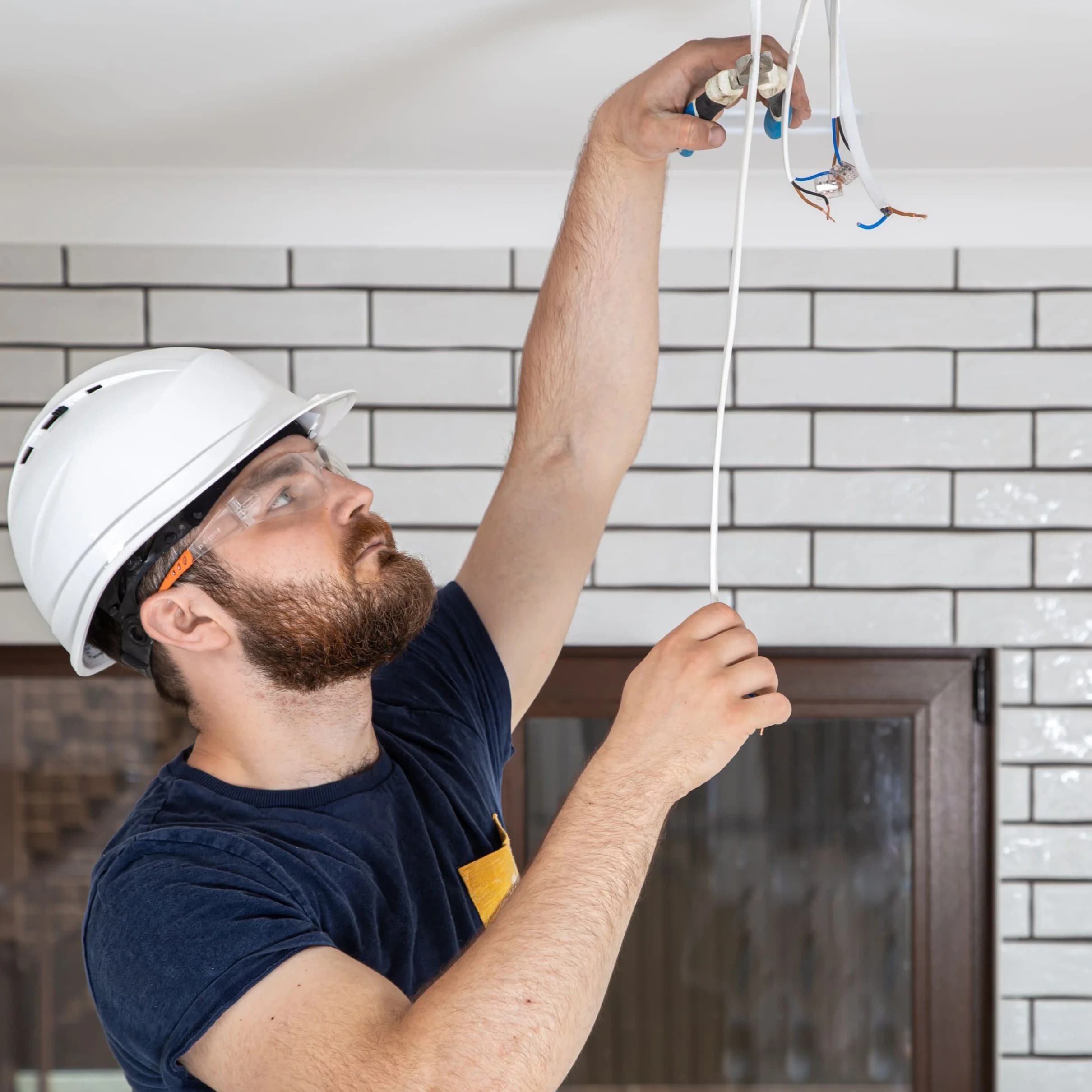 man working on electrical wires