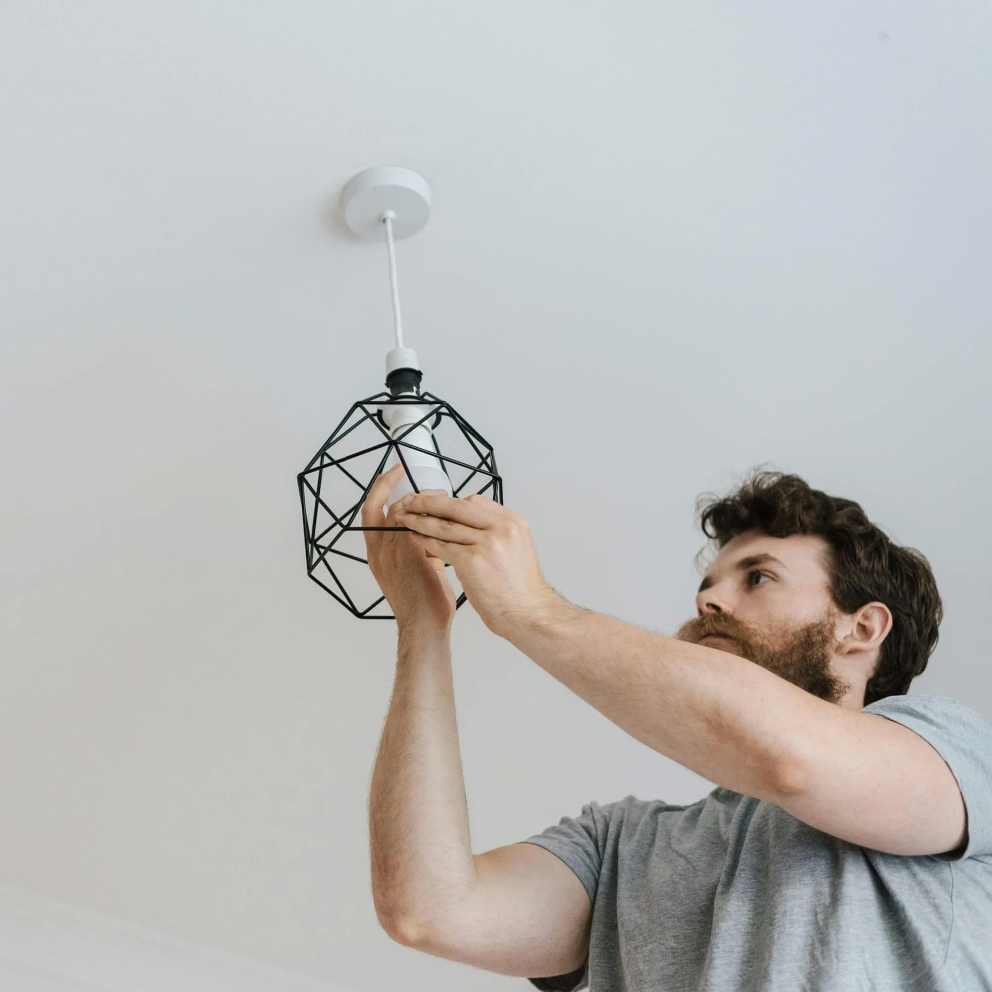 man installing light