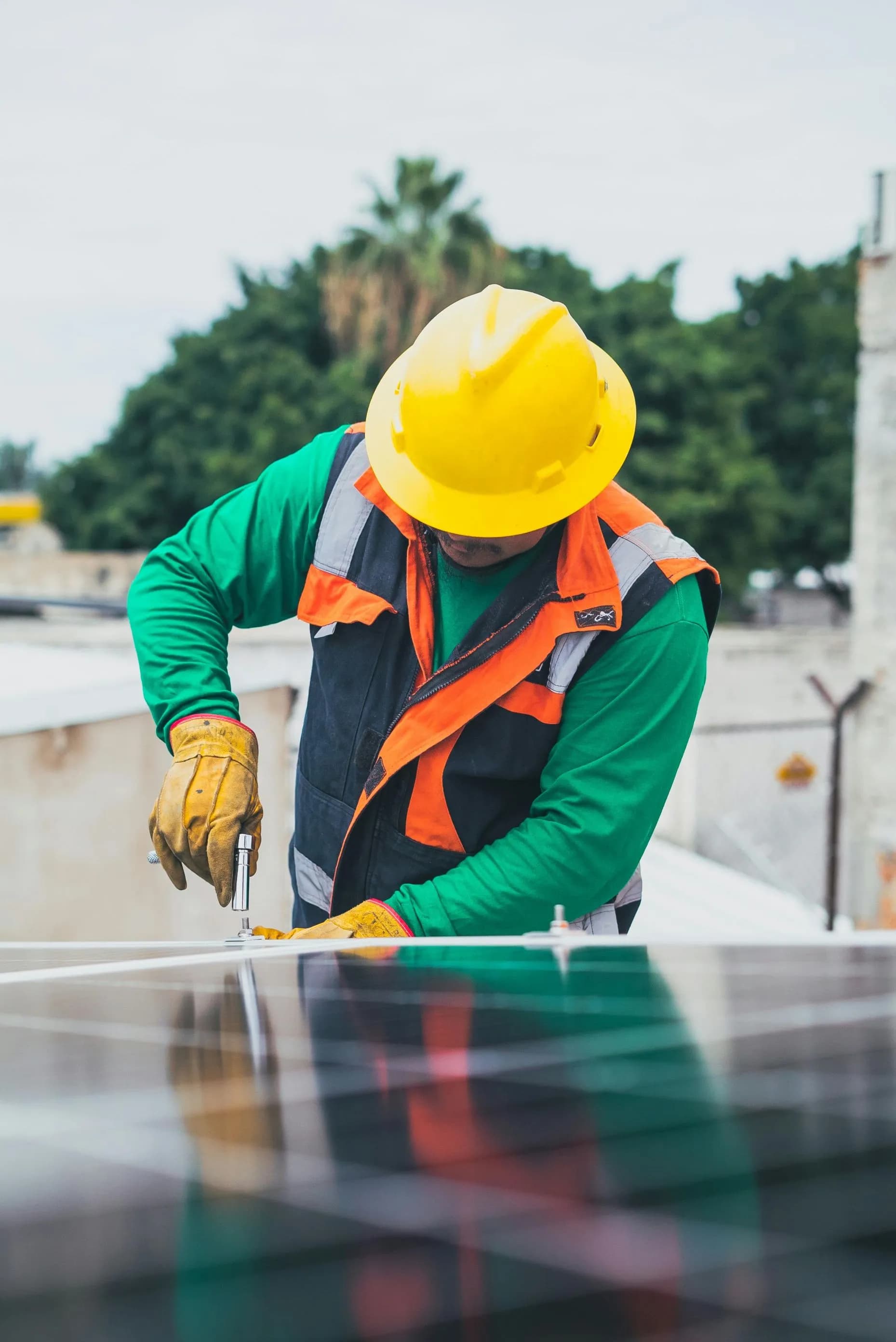 man fixing solar panel