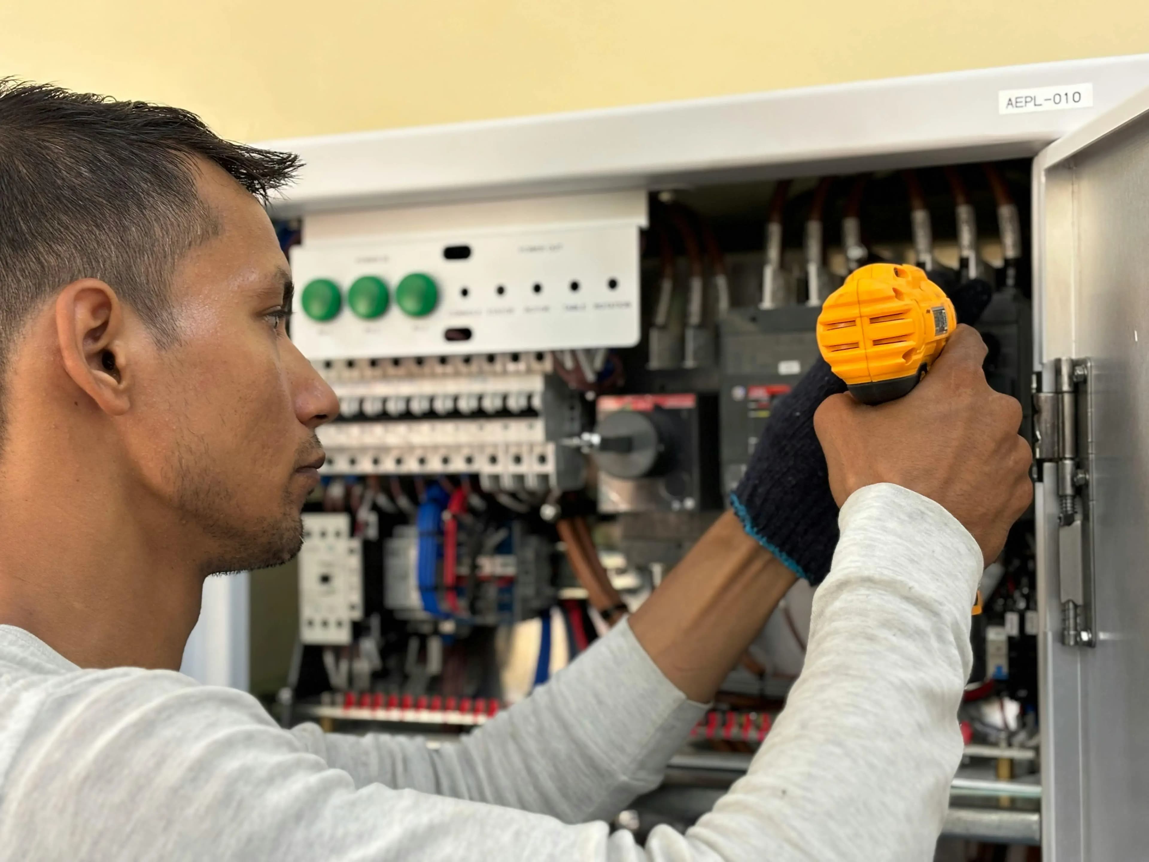 electrician repairing electric board